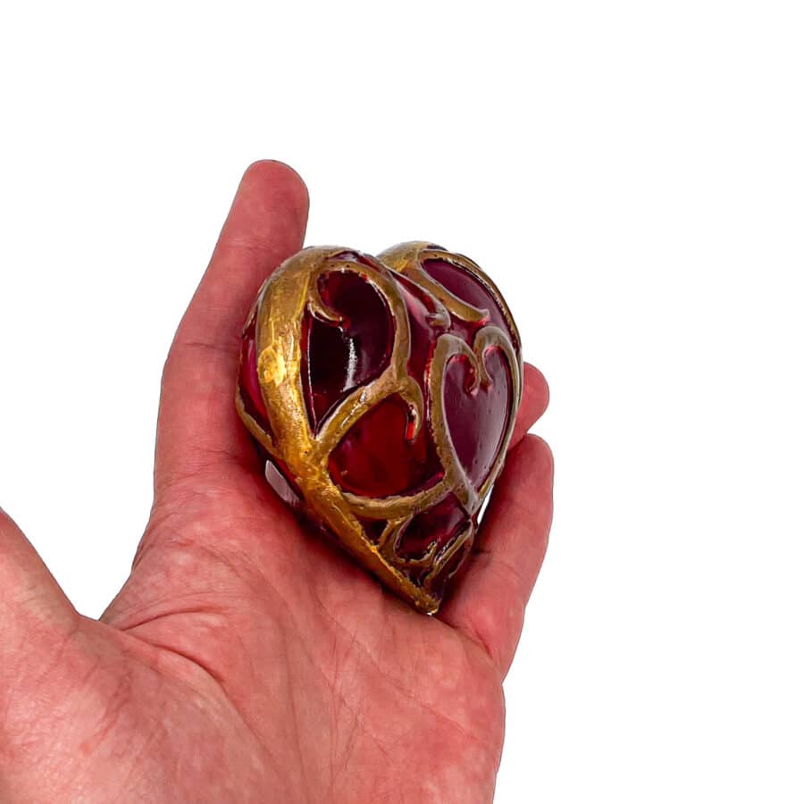 "Handcrafted Legend of Zelda Heart Container - vibrant red resin with gold accents.