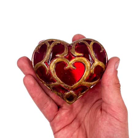 "Handcrafted Legend of Zelda Heart Container - vibrant red resin with gold accents.